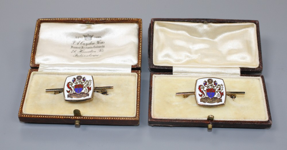 A modern pair of silver gilt and enamel brooches, decorated with ornate crest, 42mm, gross weight 14.6 grams.